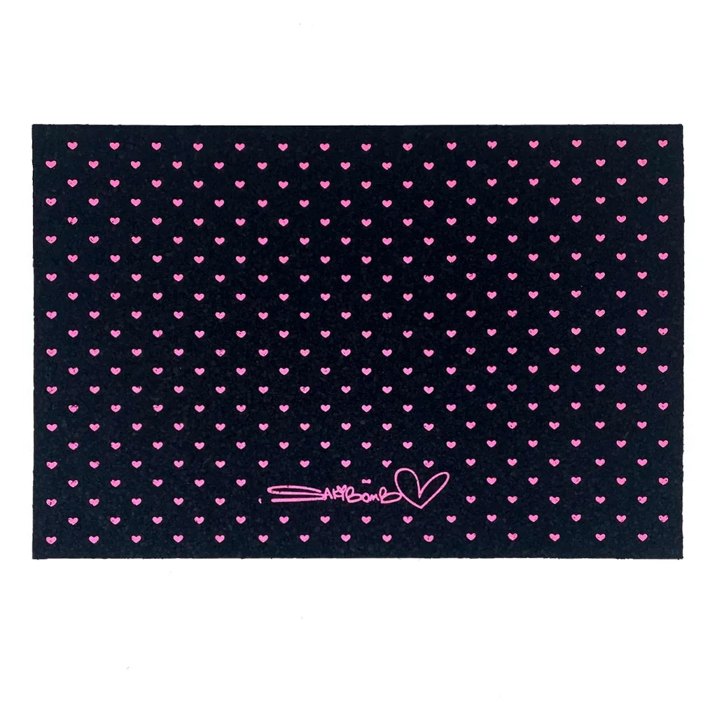 Black glass mat with pink heart pattern and Sakibomb signature, dab mat accessory