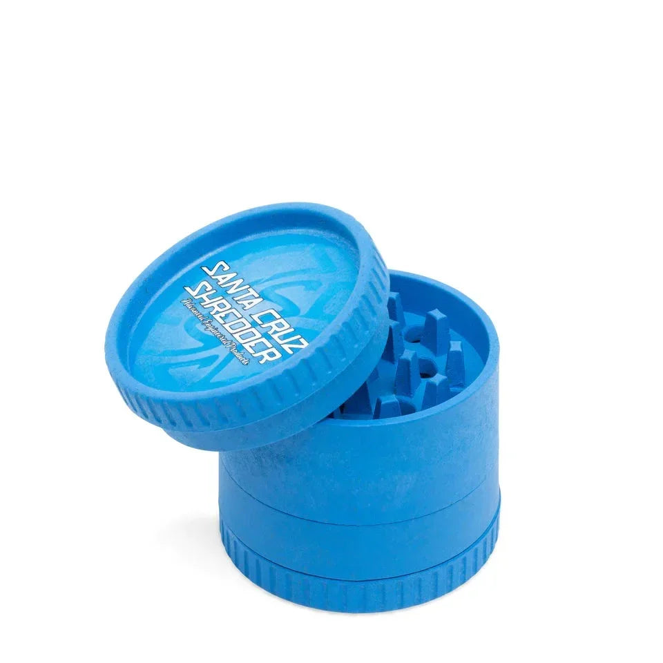 Blue biodegradable hemp 4-piece herb grinder with text on lid, open to show teeth