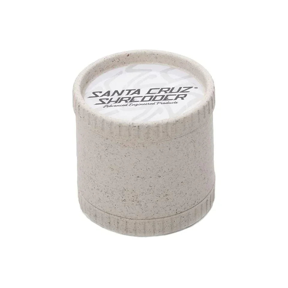 Biodegradable hemp 4-piece herb grinder with speckled texture and logo lid