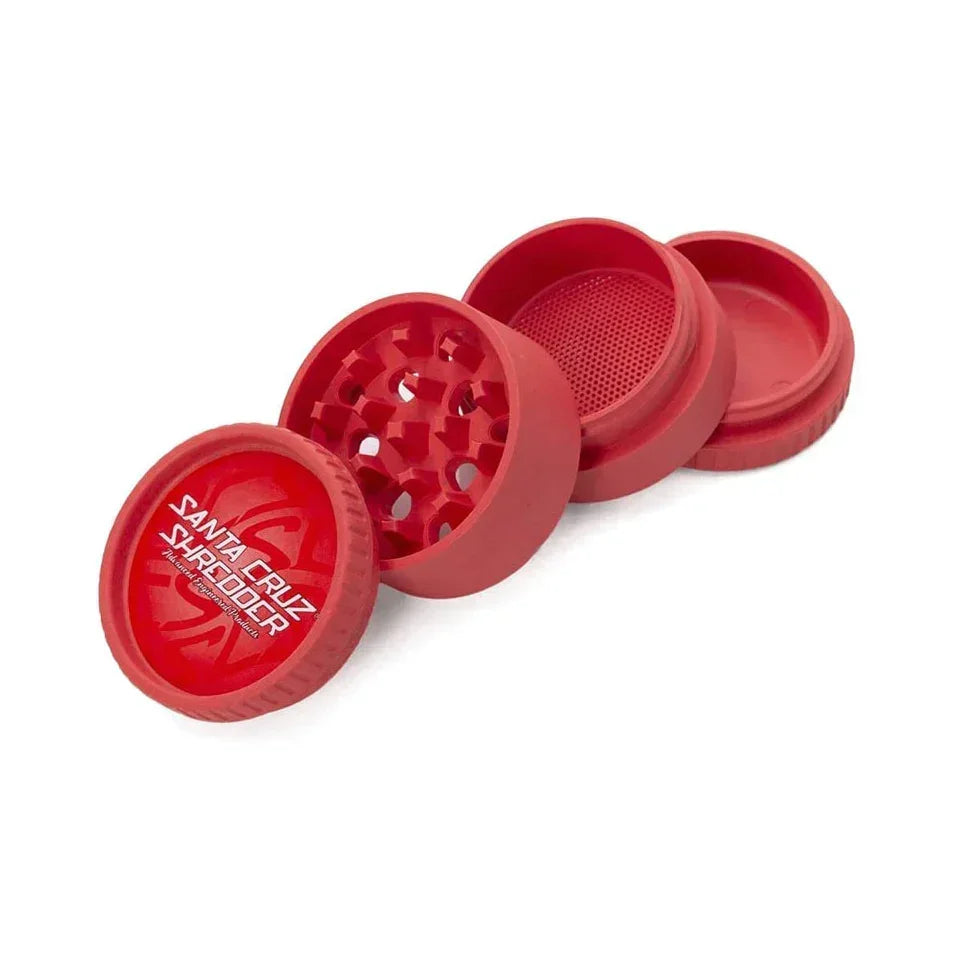 Red biodegradable hemp four-piece herb grinder with sifter on white background