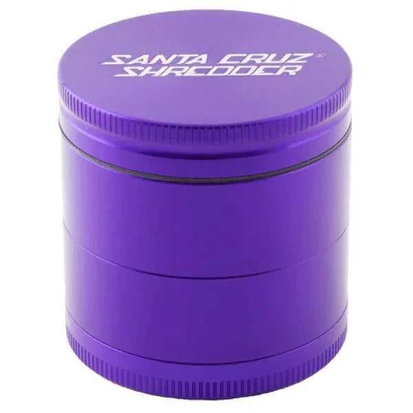 Purple metal herb grinder with 'Santa Cruz Shredder' logo on lid, cylindrical design