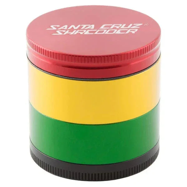 Medium rasta herb grinder with red, yellow, green, and black metal layers and textured lid