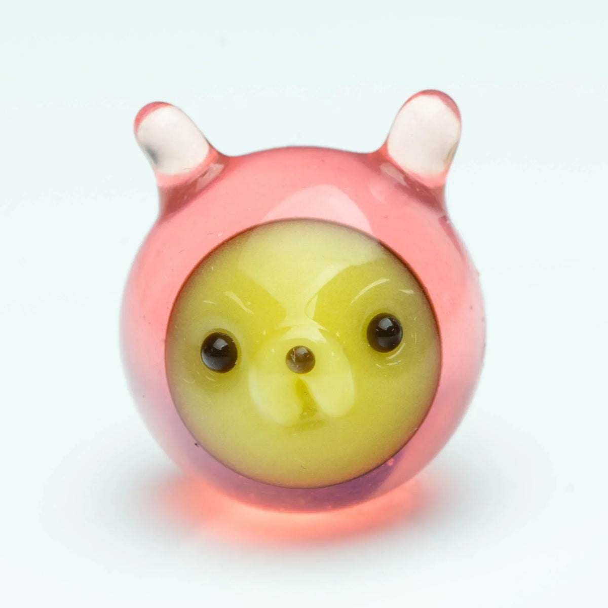 Handcrafted glass carb cap with pink ears and yellow bear face for dab rigs