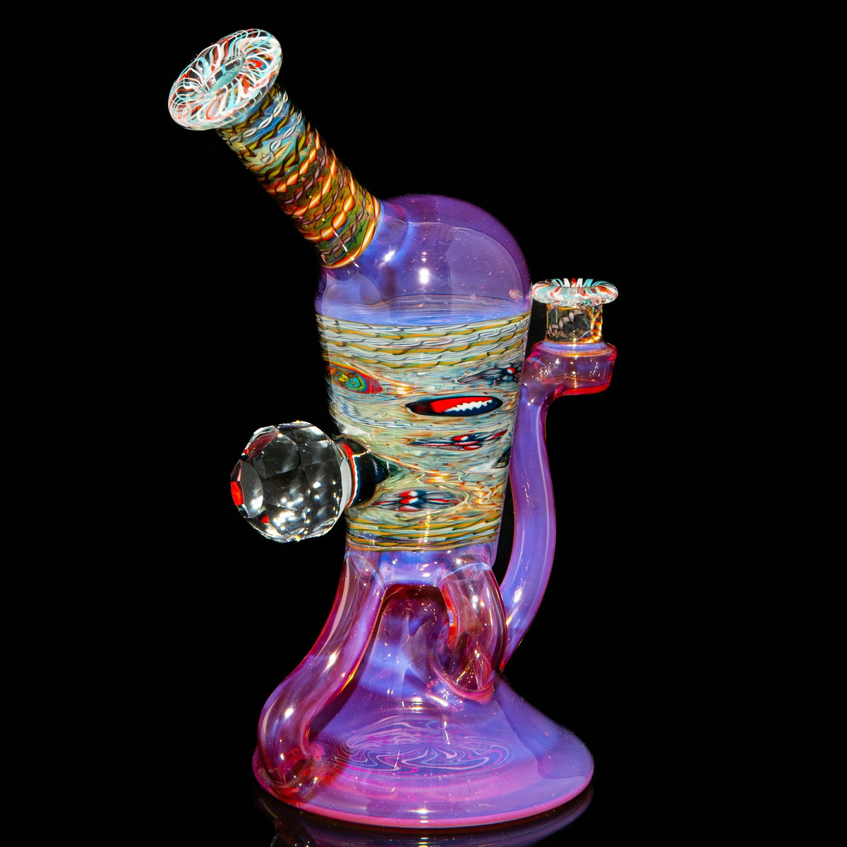 Colorful heady glass water pipe with intricate designs on a black background