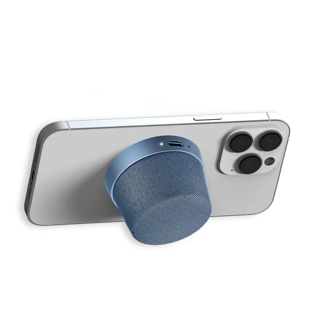 Blue magnetic wireless Bluetooth speaker attached to the back of a smartphone