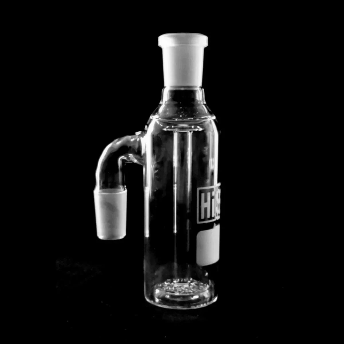 Clear glass ash catcher accessory for water pipe against black background