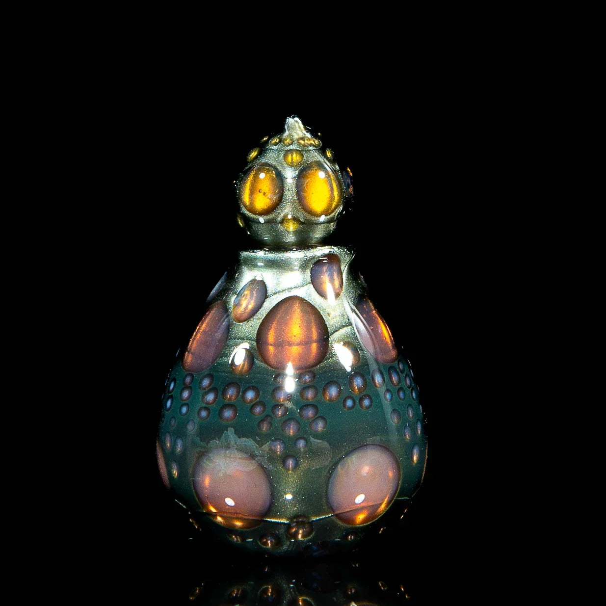 Heady glass art with multicolored bubble accents on a black background
