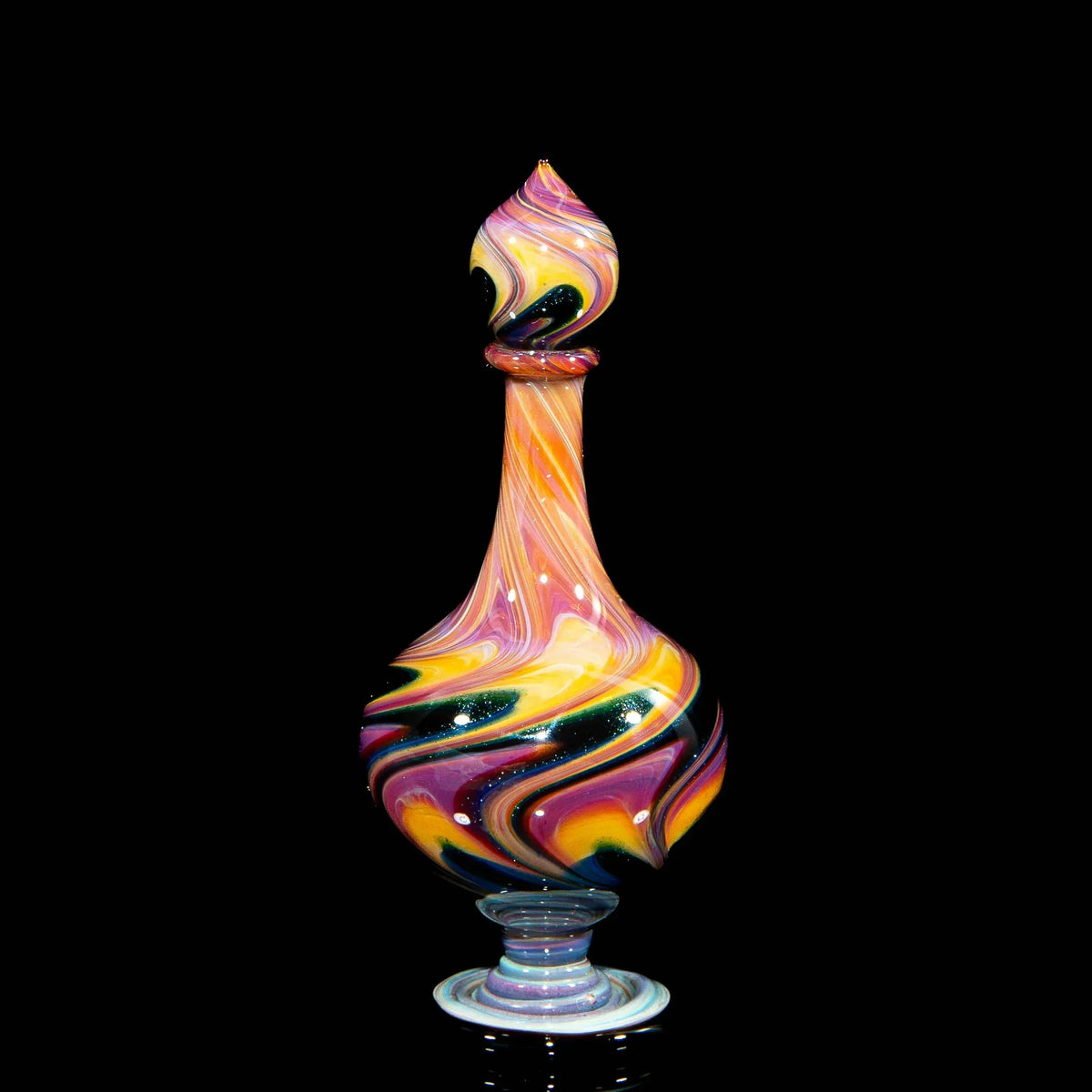 Colorful heady glass art bottle with swirled patterns on black background