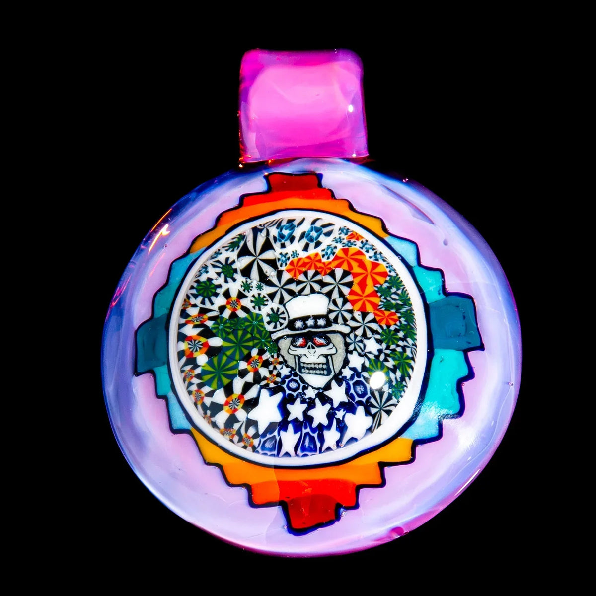 Colorful glass pendant featuring a skeleton face, geometric and star patterns, psychedelic art