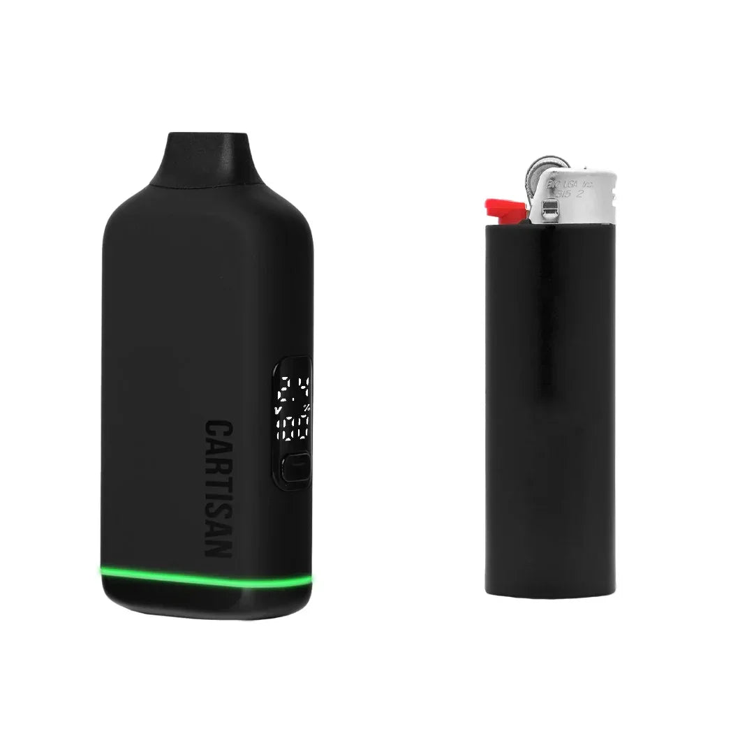 Black Cartisan vaporizer with LED display next to a black lighter on white background