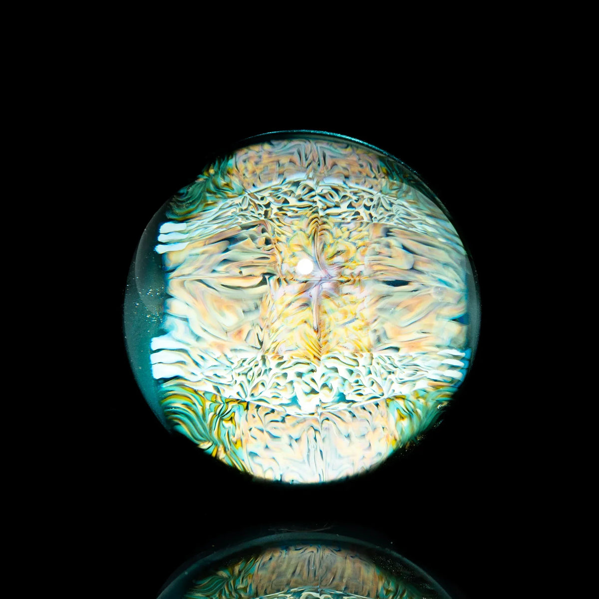 Intricate glass marble with colorful, swirling patterns on a black background