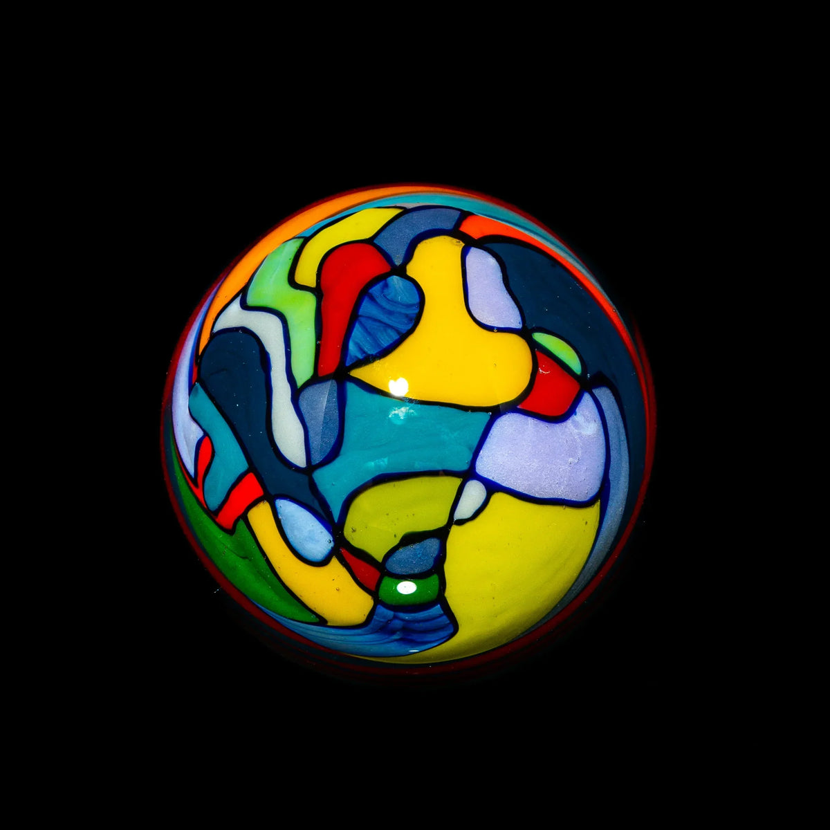Colorful abstract glass marble with vibrant stained glass pattern on black background