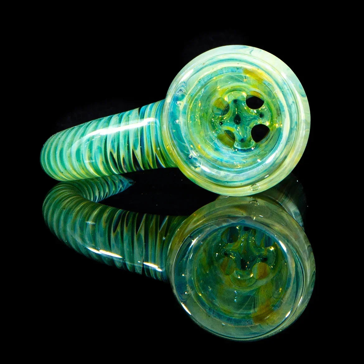 Hand-blown glass smoking pipe with teal and yellow swirl pattern on black reflective surface
