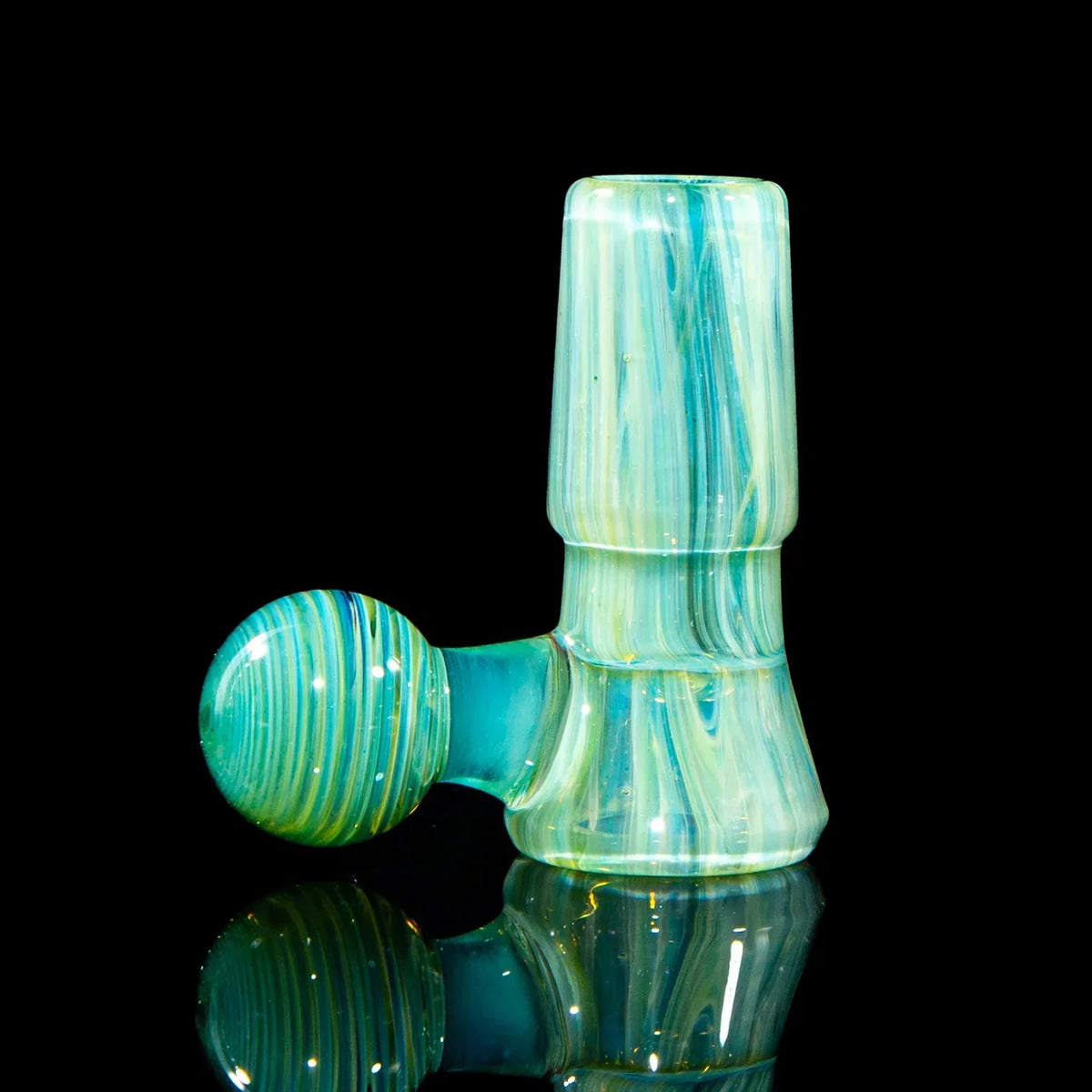 Hand-blown glass bowl attachment in teal and yellow for water pipe or dab rig, on black background.