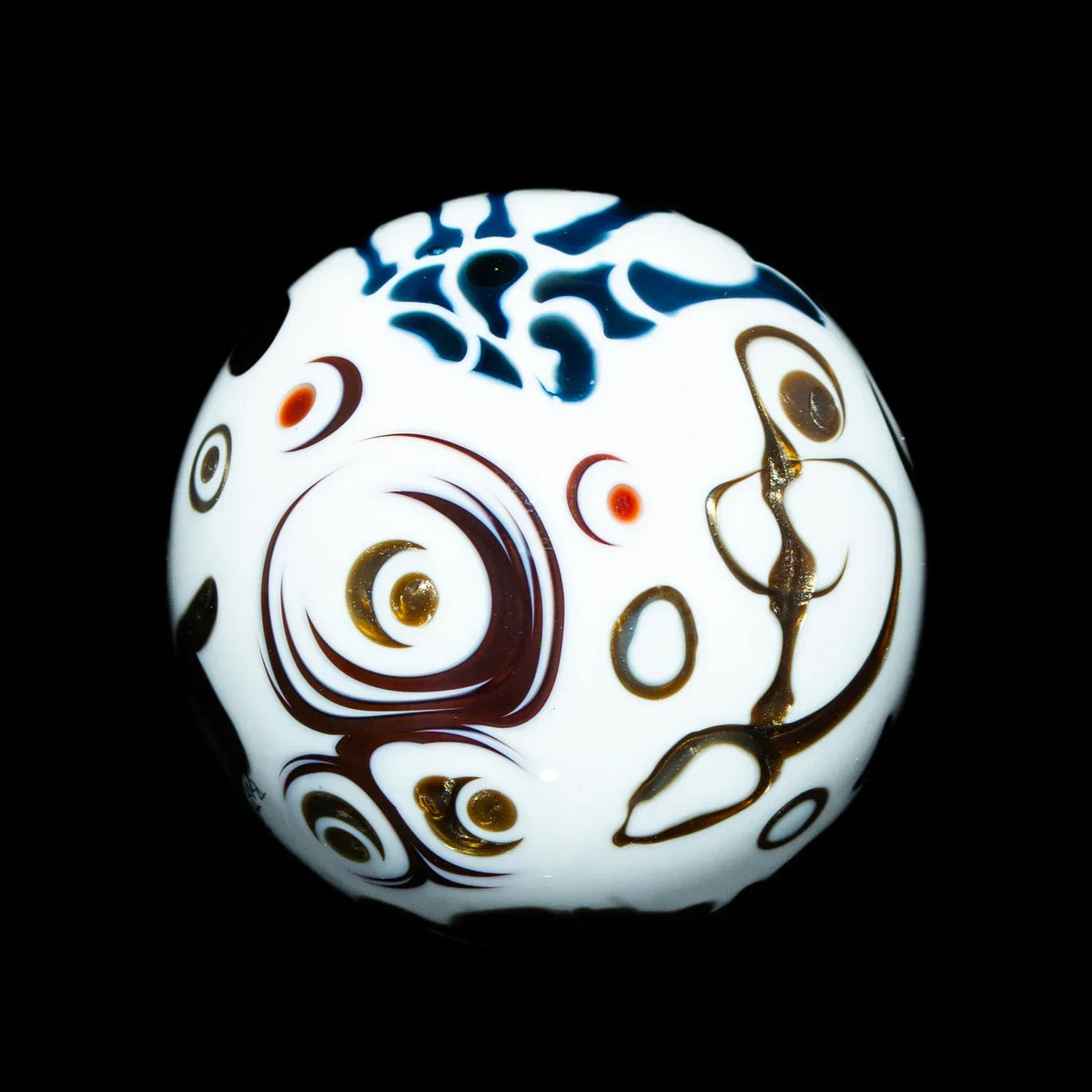 White glass marble with colorful abstract swirls and patterns on black background.