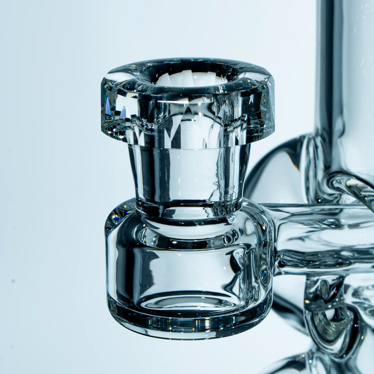 Closeup of clear glass bong bowl with thick, detailed glasswork for smoking accessories