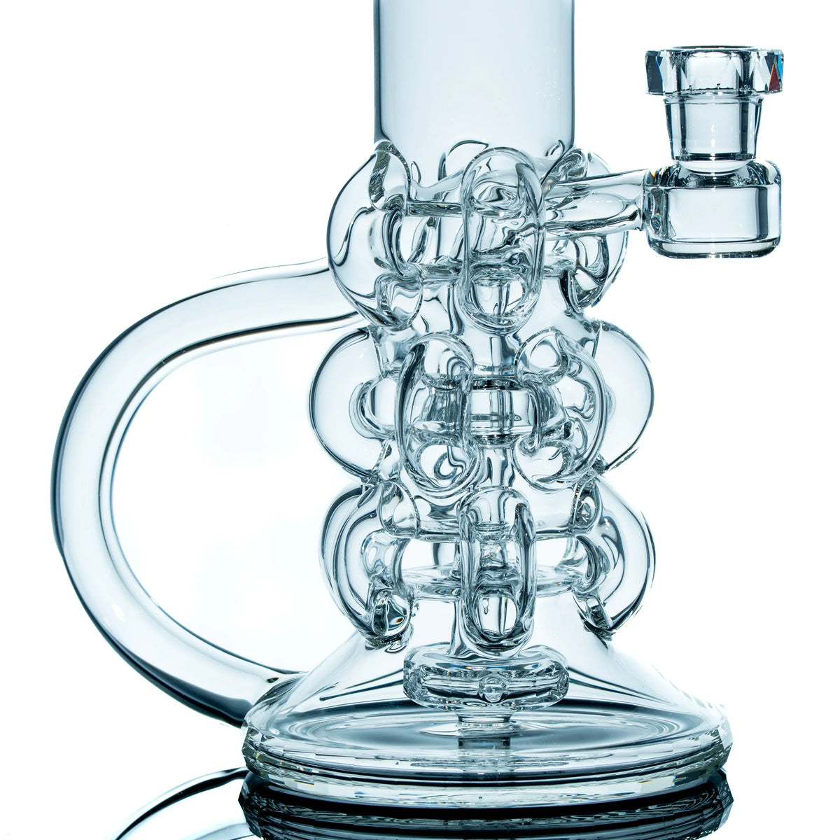Intricately designed clear glass water pipe with artistic tubing and a wide base