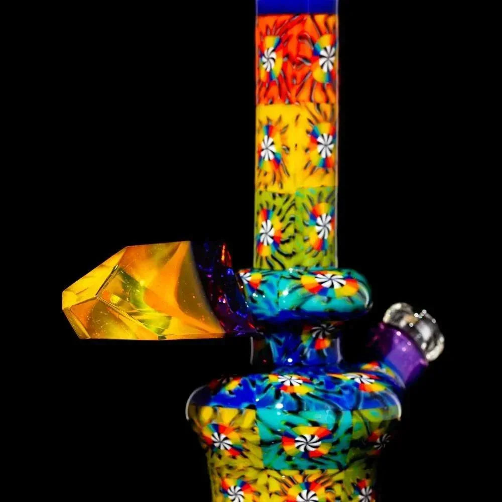 Vibrant hand-blown glass mini tube with colorful floral patterns and geometric accents.