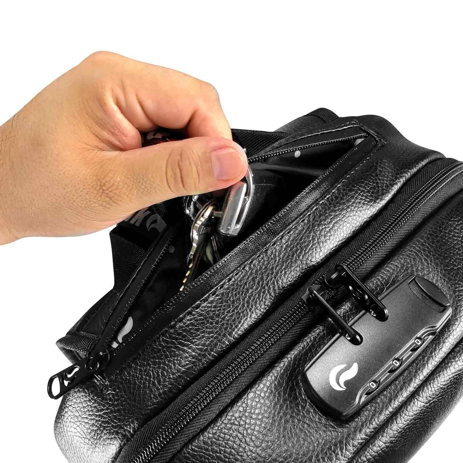 Hand placing keys into black zippered smell-proof stash bag with lock