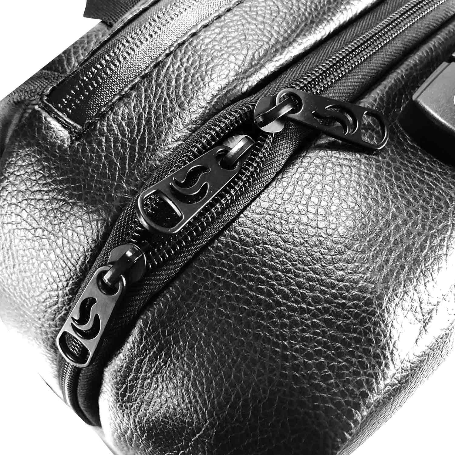 Close-up of black leather smell-proof bag with dual zippers and textured finish