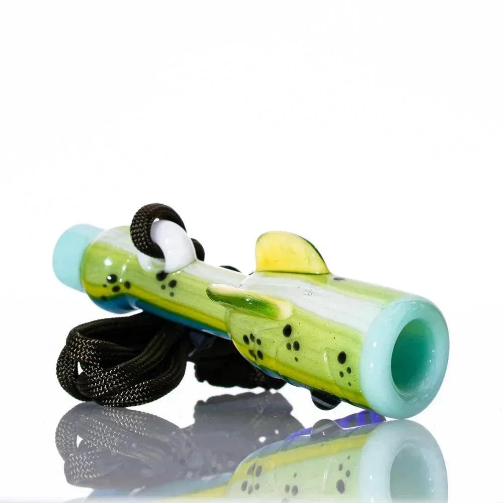 Handcrafted glass fish whistle with green and yellow mahi mahi design and attached lanyard.