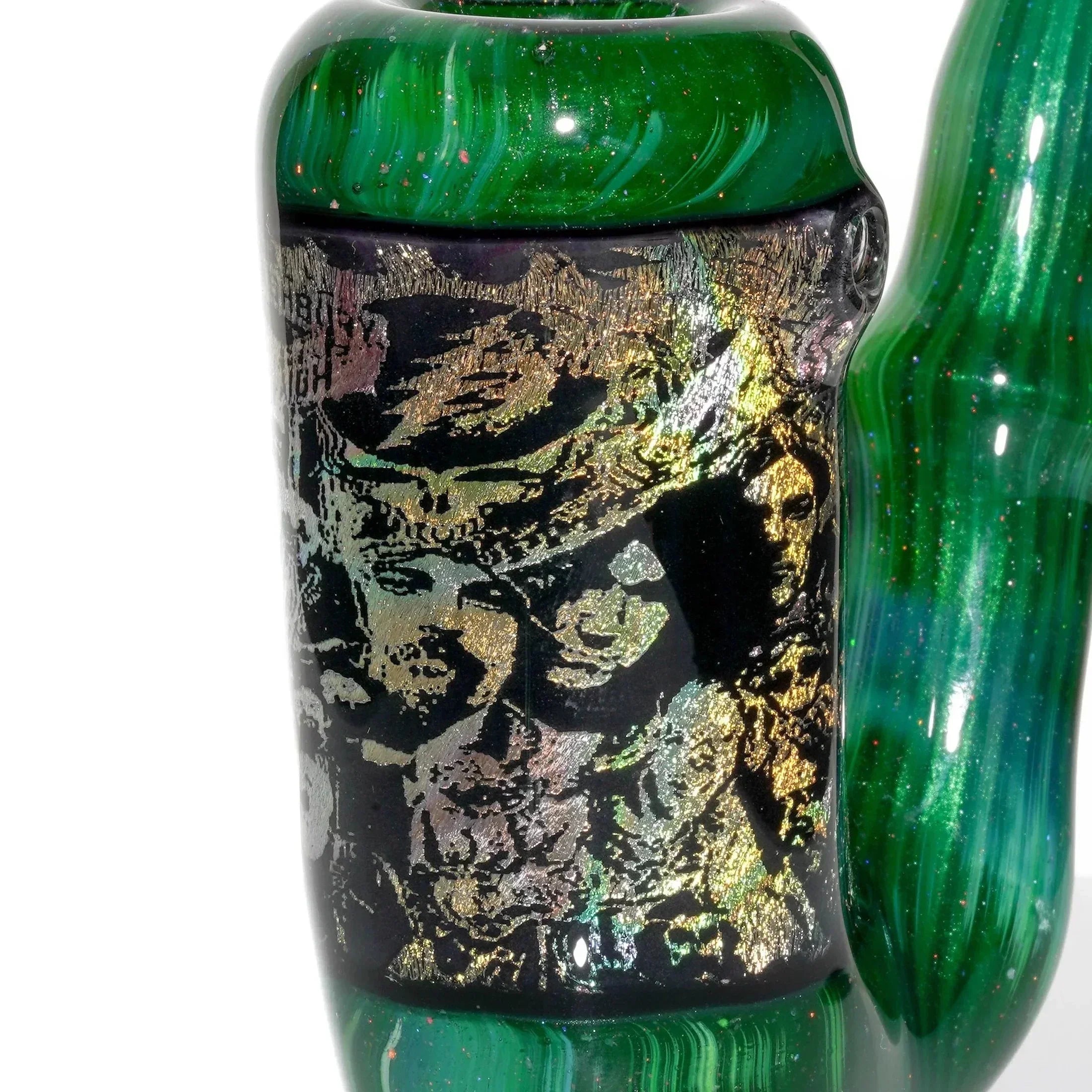 Green glass pipe with metallic abstract design and intricate gold detailing