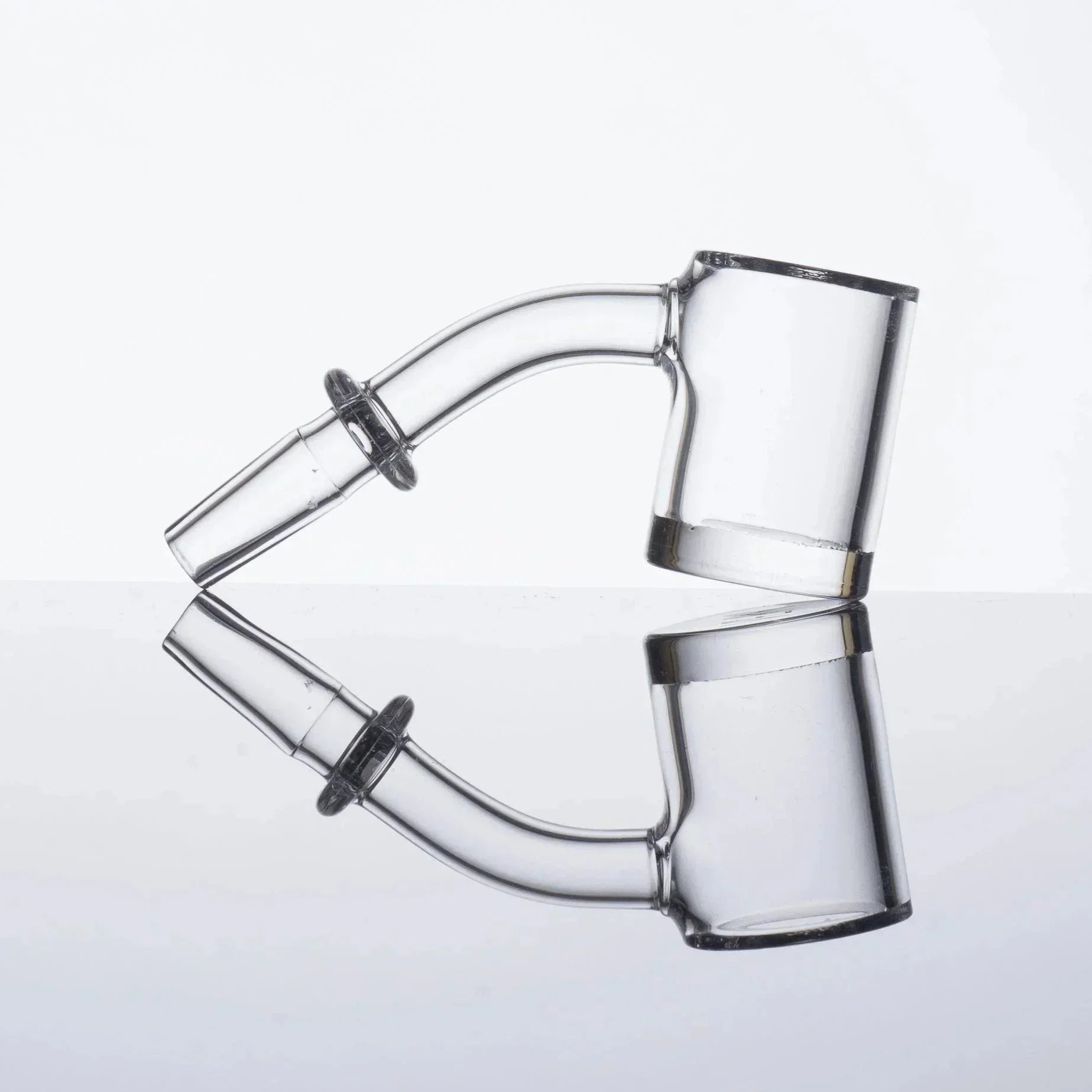 Clear glass dab rig accessory with curved neck and reflective surface