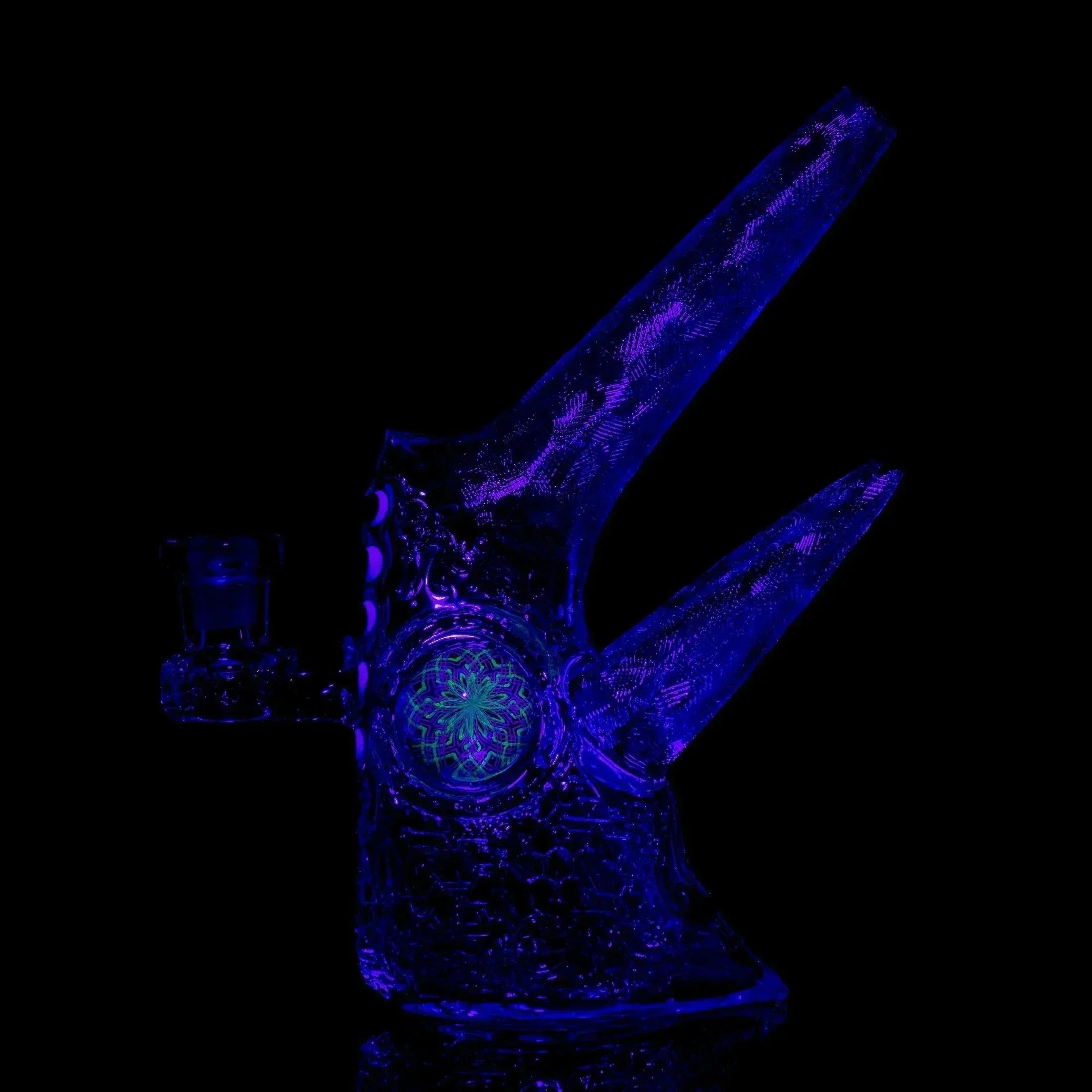 UV-reactive glass chameleon rig with two angled horns and intricate glowing details