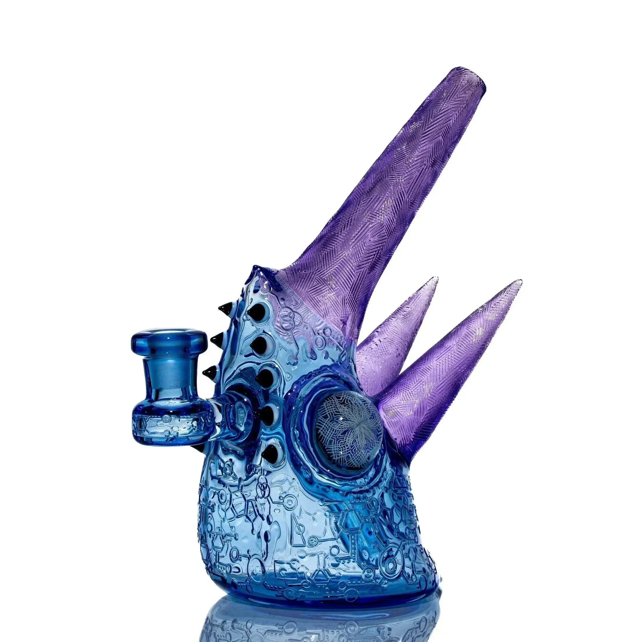 Blue and purple spiked glass water pipe with intricate patterns on white background