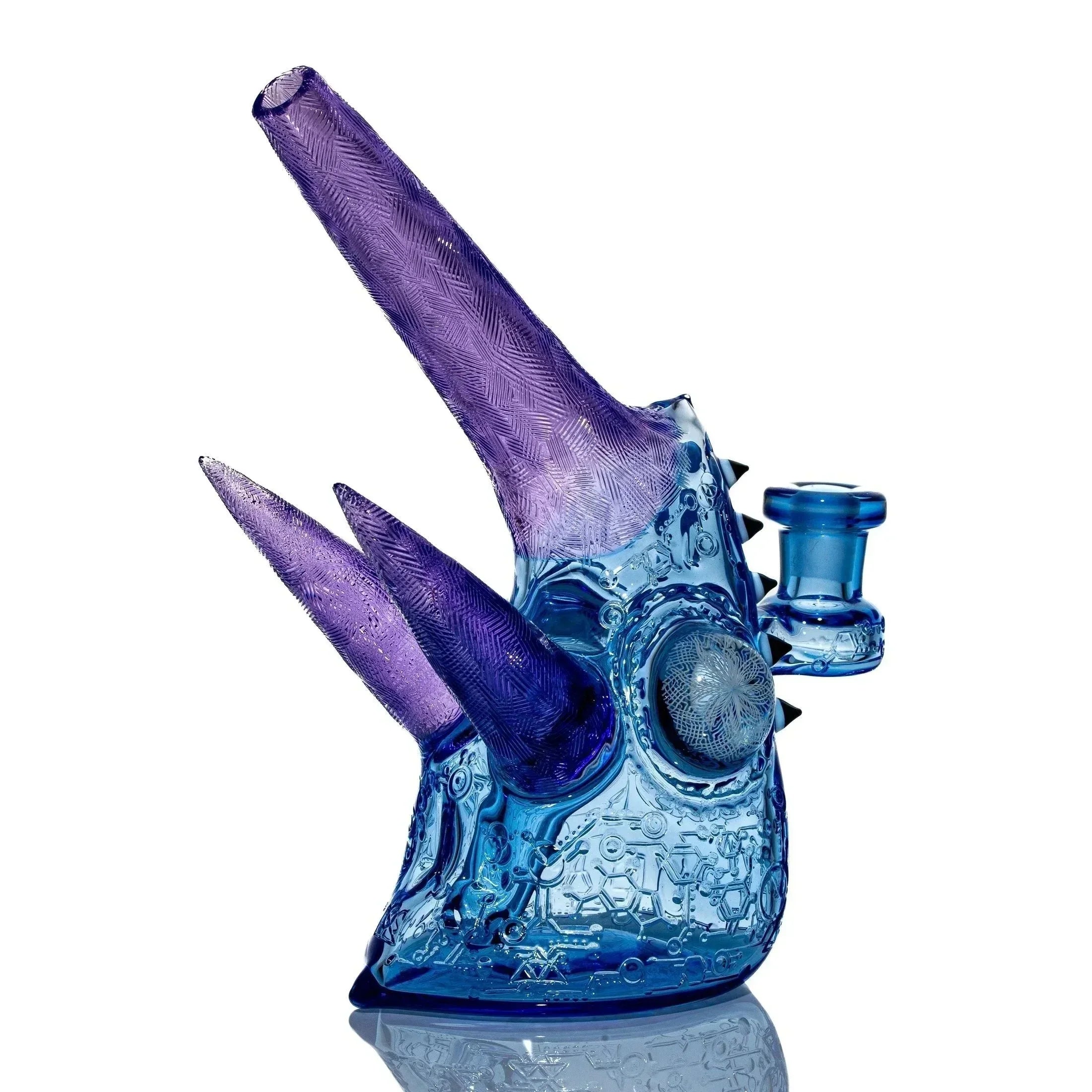Blue and purple sculpted glass water pipe with horned design and textured details