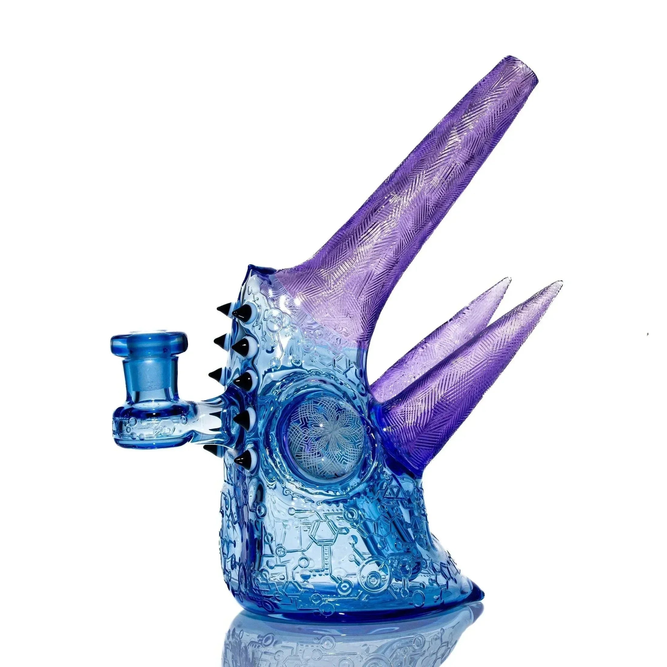 Blue and purple heady glass water pipe with intricate patterns and spiked accents