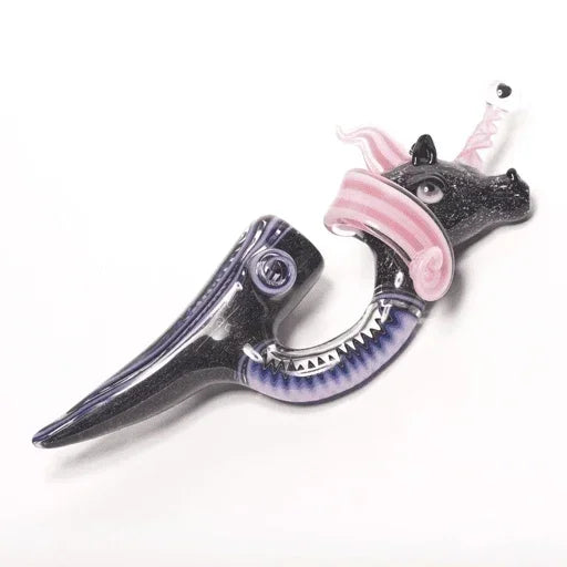 Black and pink dragon glass pipe with intricate detailing and sharp teeth design