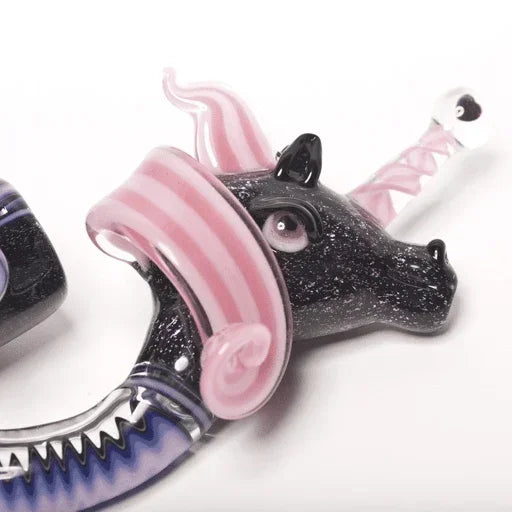 Black and pink glass unicorn pipe with striped horn and glittery finish