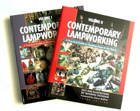Two Contemporary Lampworking books on shaping glass, featuring colorful glasswork images.