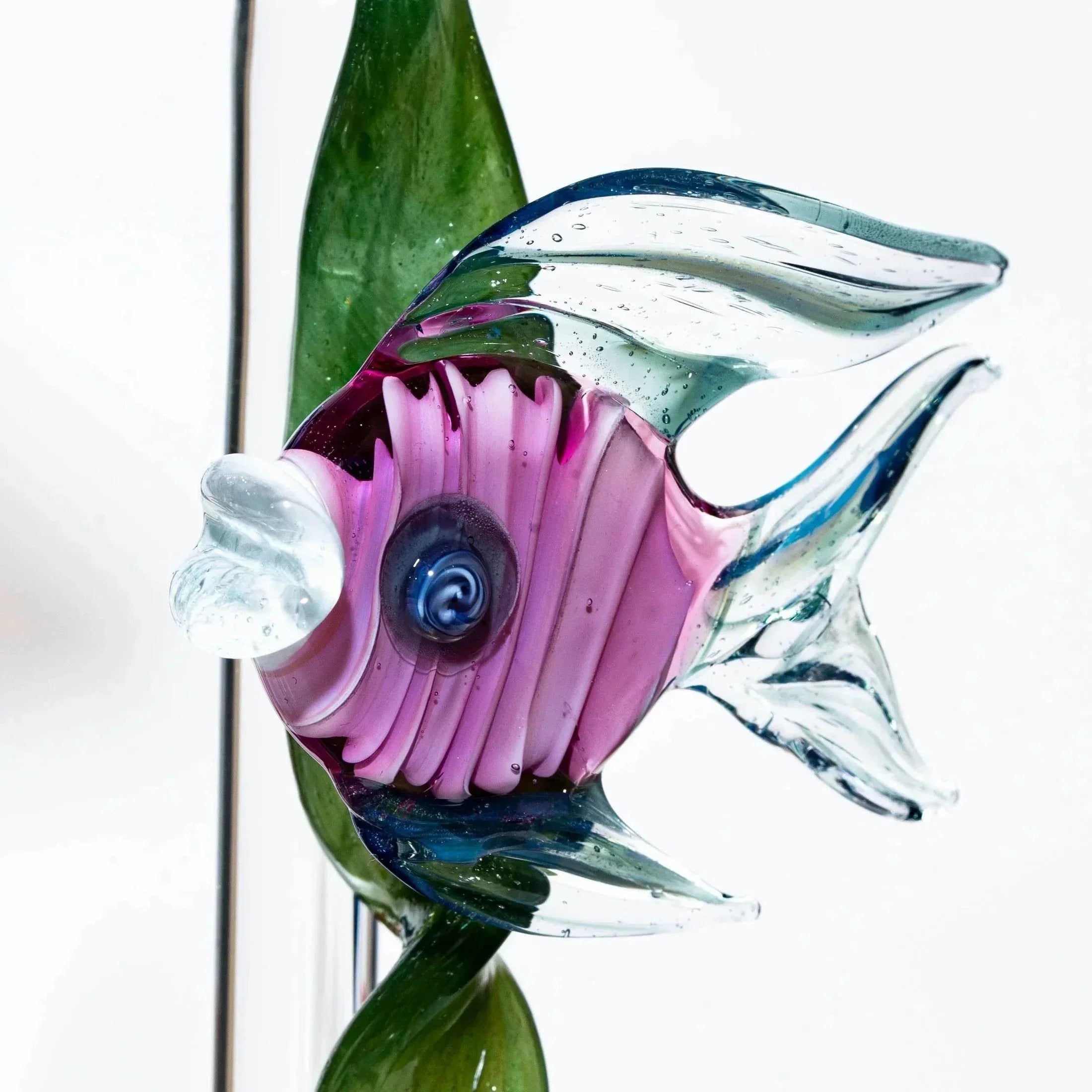Handcrafted glass fish sculpture with pink body and clear fins, aquatic art decor