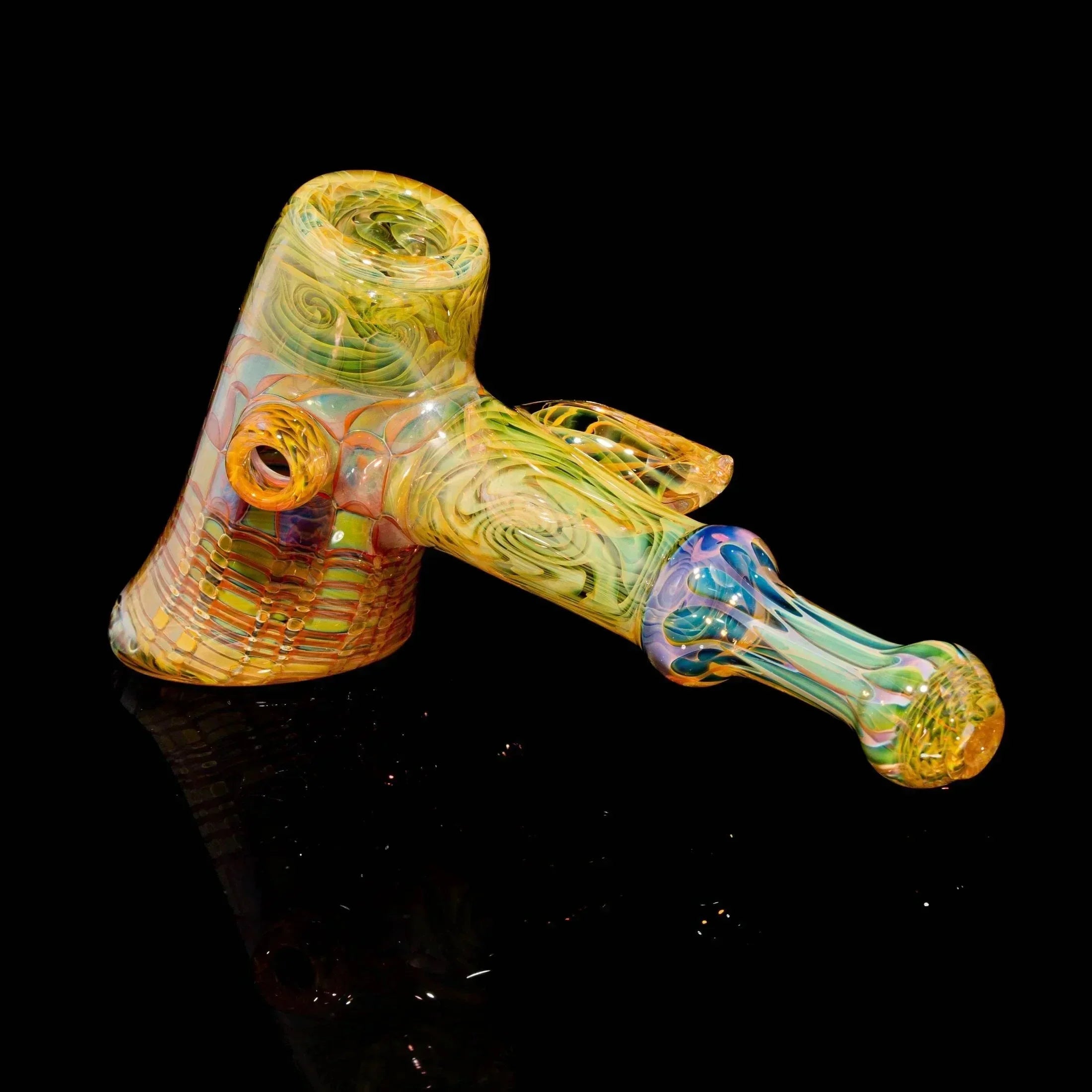Colorful heady glass pipe with intricate patterns on a black background