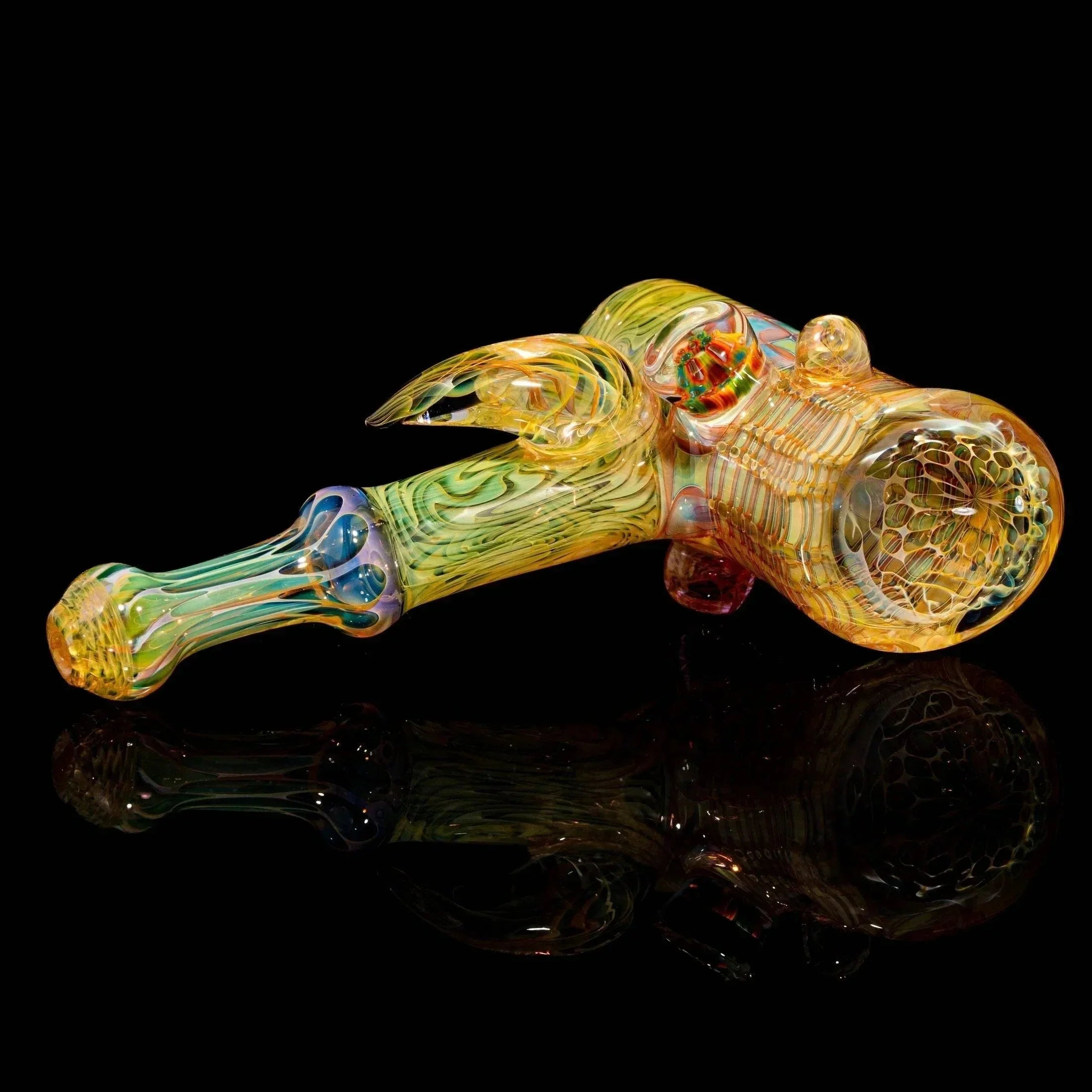 Heady glass hand pipe with intricate multicolor patterns on black background