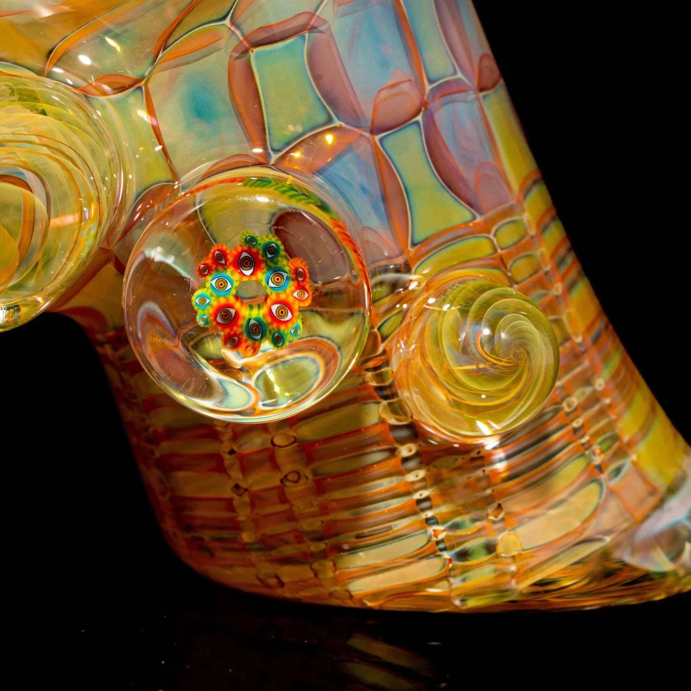 Close-up of colorful heady glass pipe with intricate patterns and marble accents