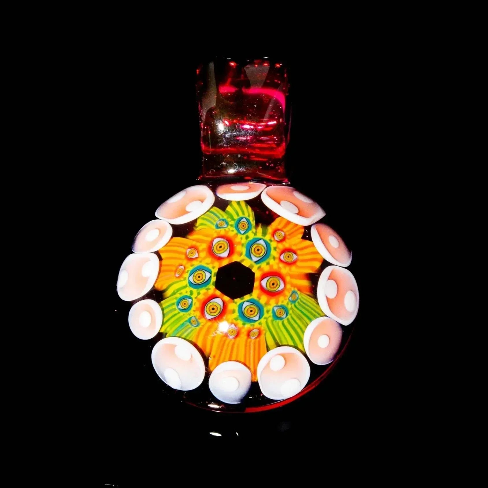 Colorful hand-blown glass disc with vibrant psychedelic patterns and round white accents