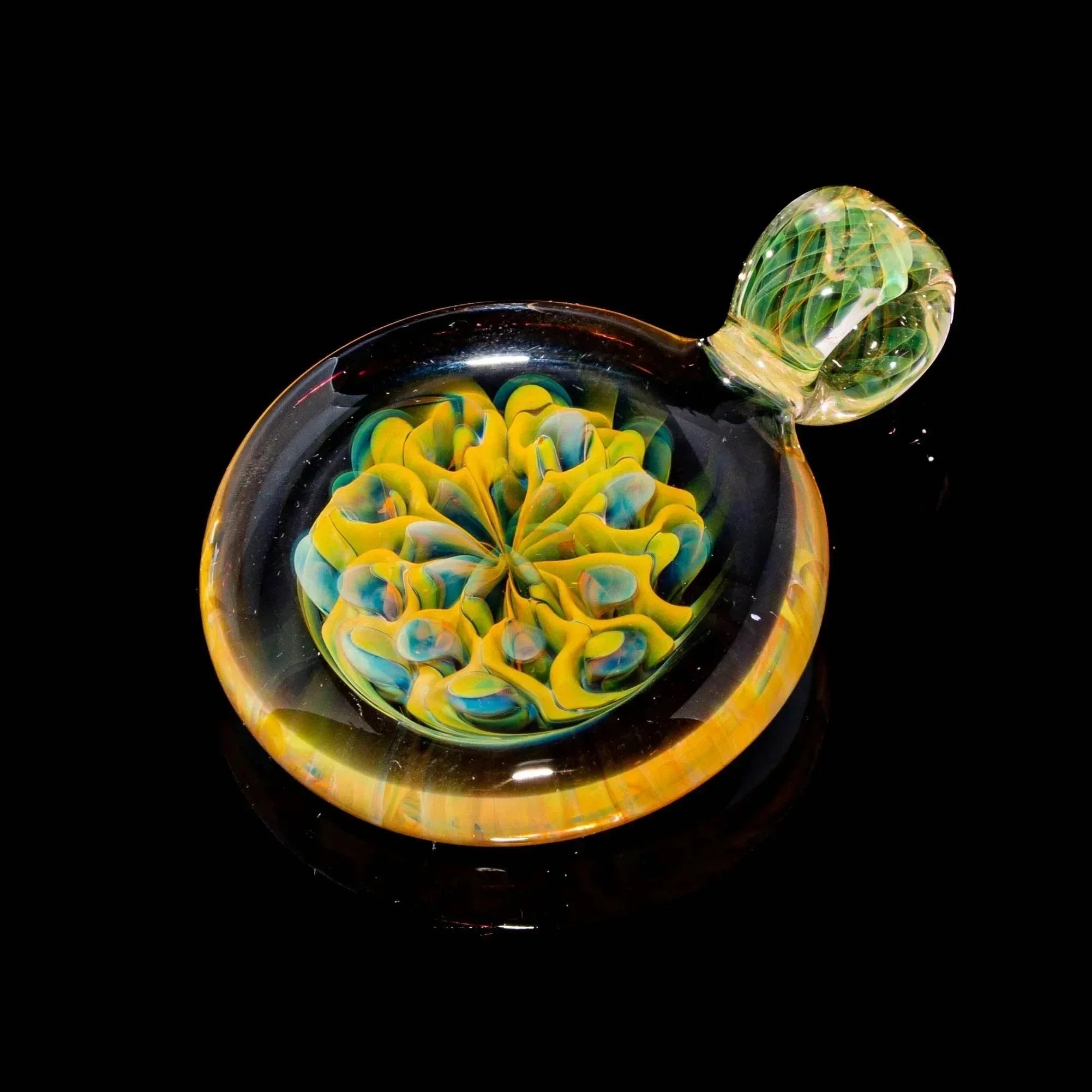 Handcrafted glass pendant with vibrant yellow and blue flower design on black background