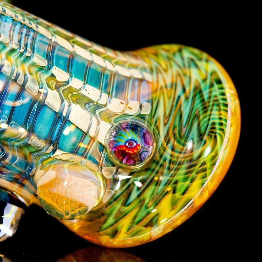 Colorful heady glass pipe with intricate patterns and marbled accents on black background