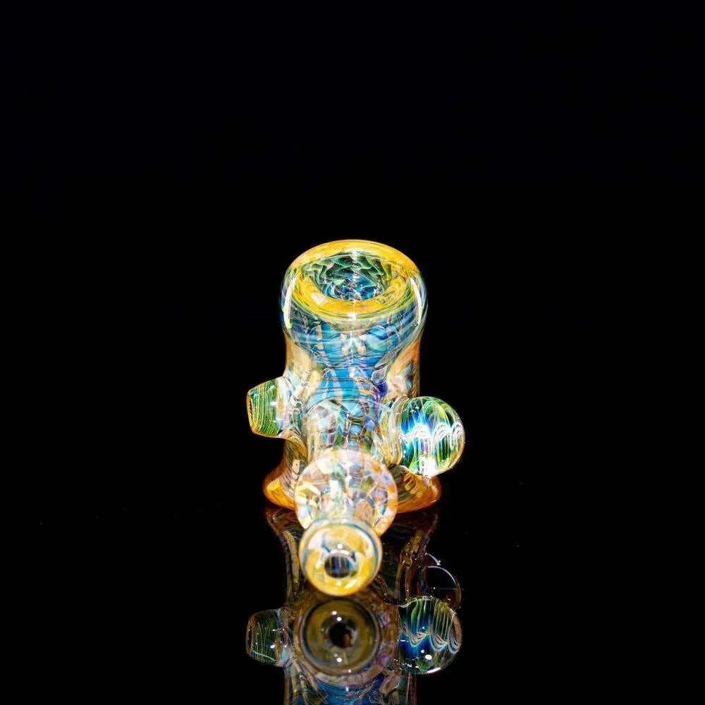 Colorful handblown glass pipe with intricate swirling patterns on a black background
