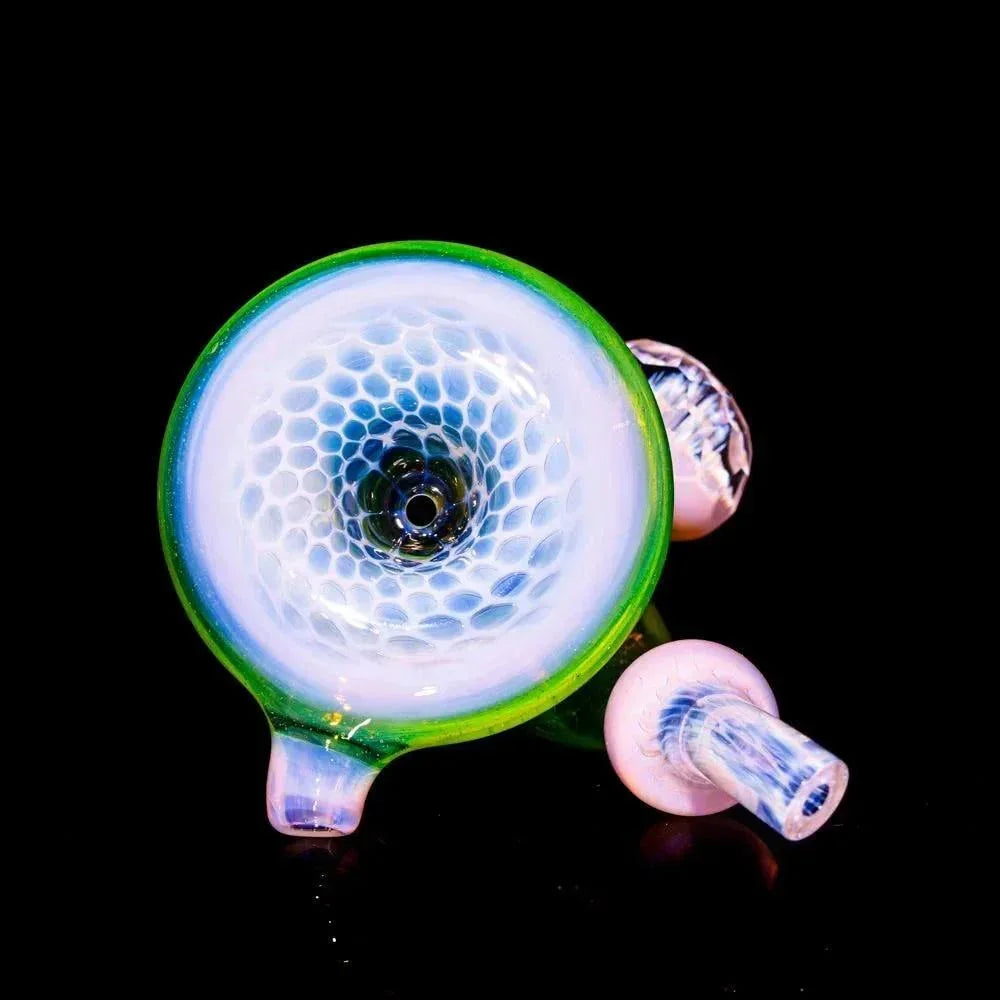 Faceted glass Sherlock pipe with honeycomb pattern, green rim, and clear stem on black background