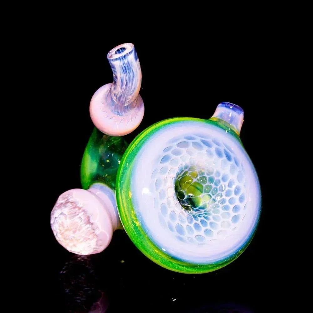Colorful glass sherlock pipe with honeycomb pattern and green, white, and pink accents on black background.