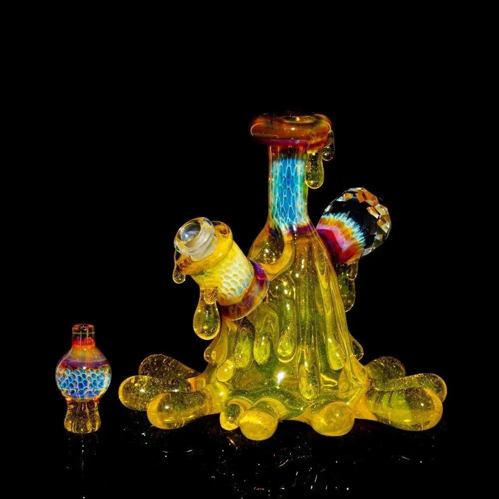 Colorful heady glass water pipe with drip design and matching cap on black background
