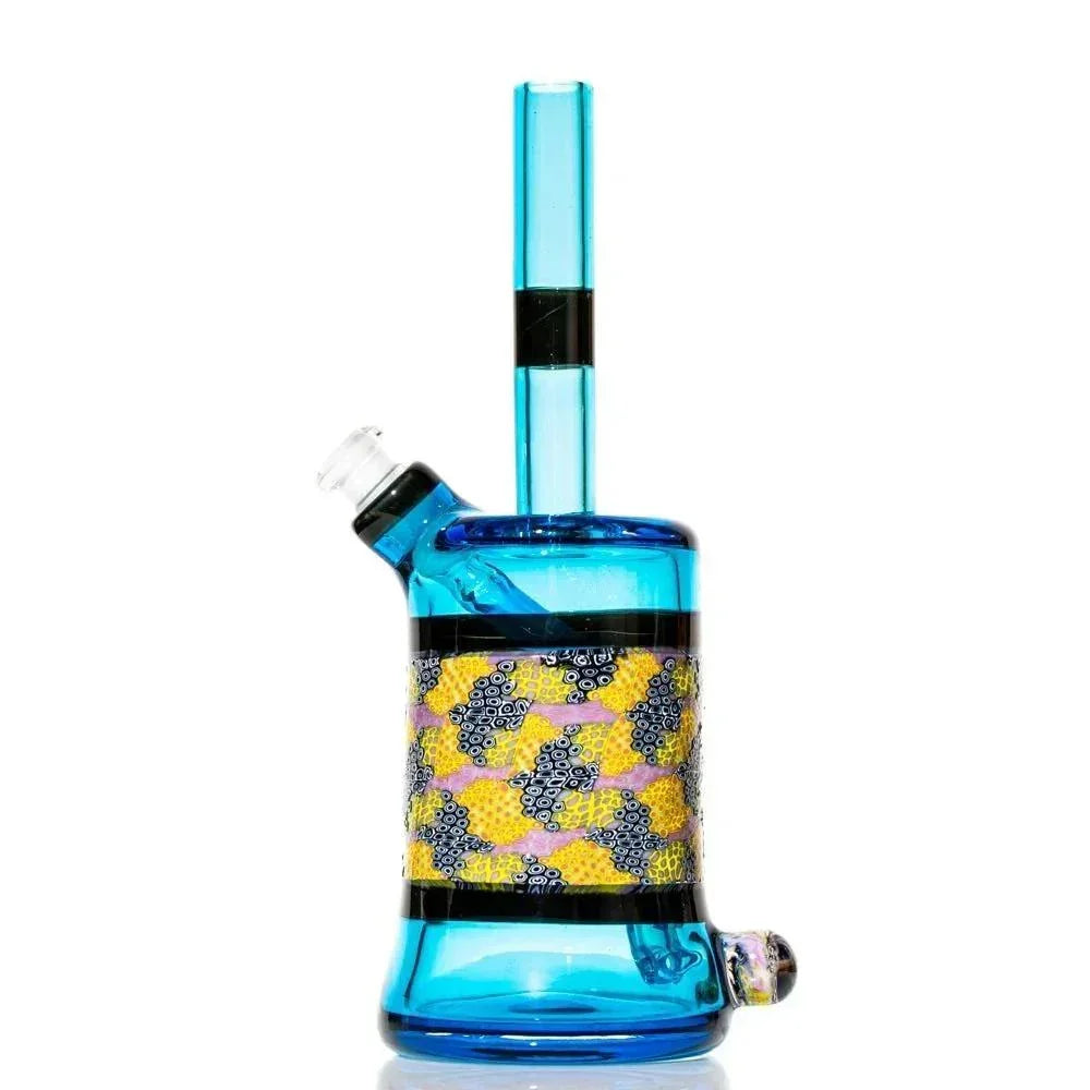 Blue glass rig with colorful murrine pattern, side view, on white background