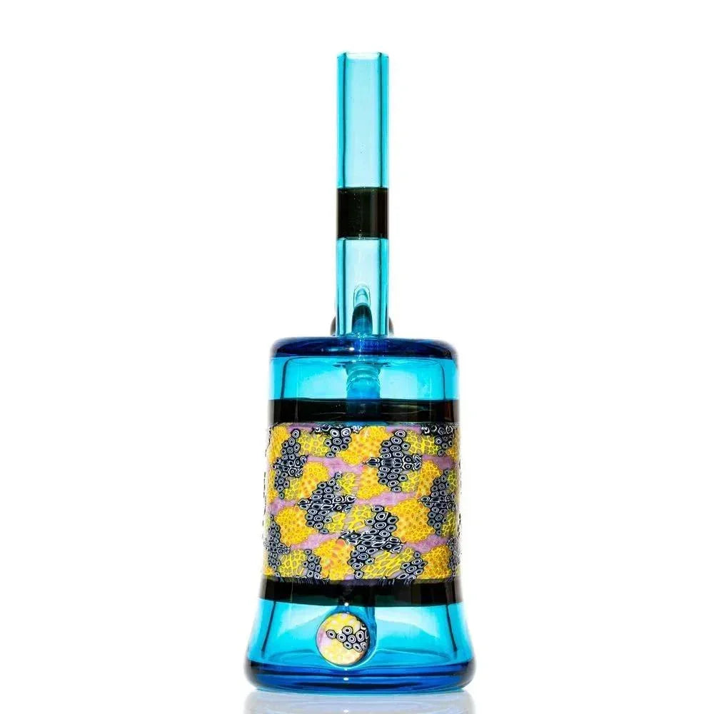 Blue glass water pipe with colorful murrine pattern on cylindrical body, white background