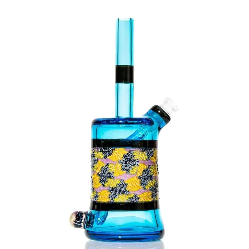 Blue glass water pipe with detailed murrine pattern and black accents, isolated on white background.