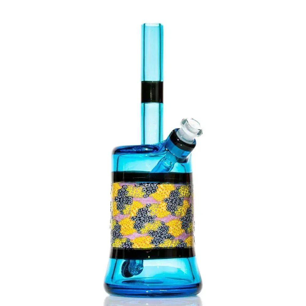 Blue glass water pipe with intricate yellow and purple murrine design on white background