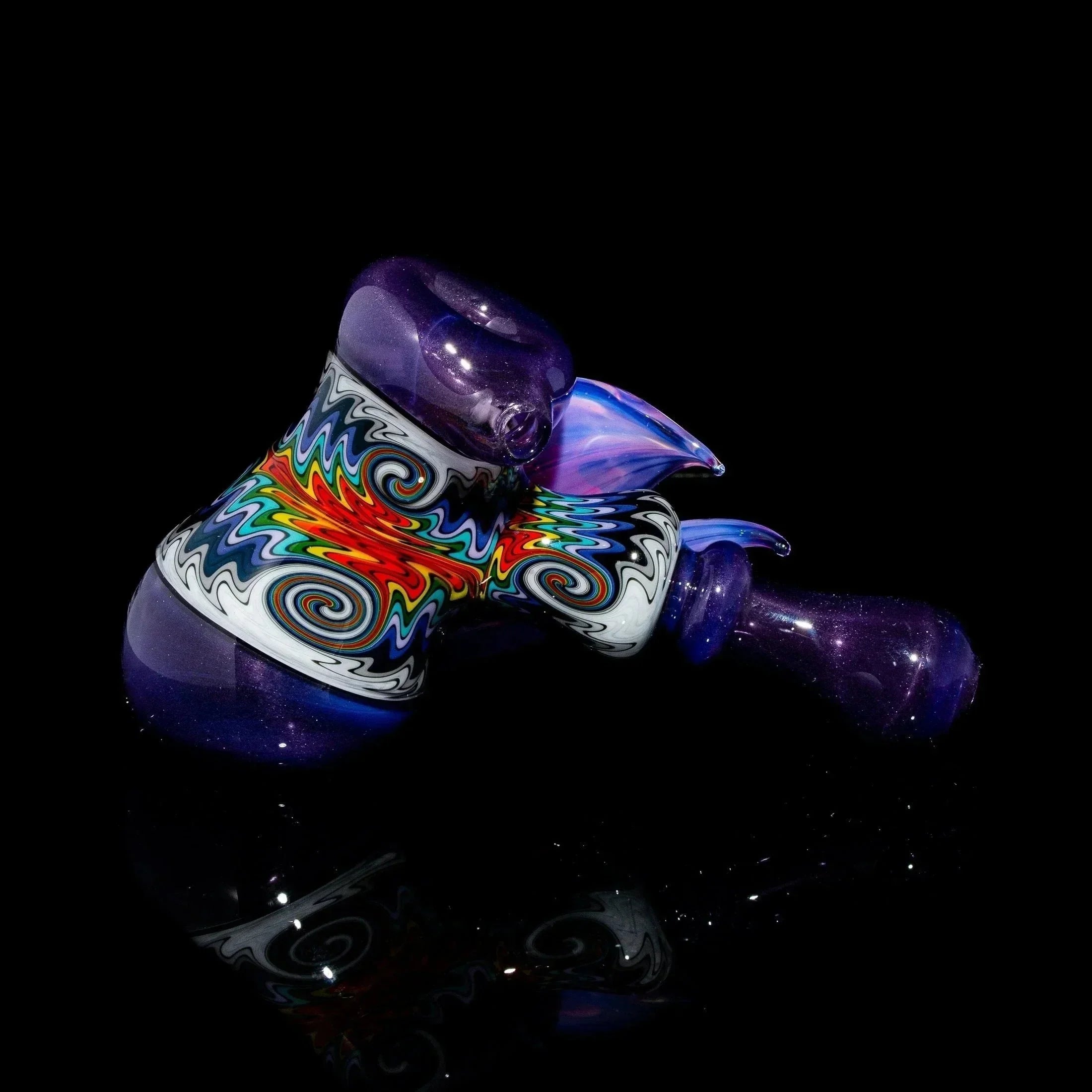 Purple glass hammer pipe with colorful linework and flower design on black background